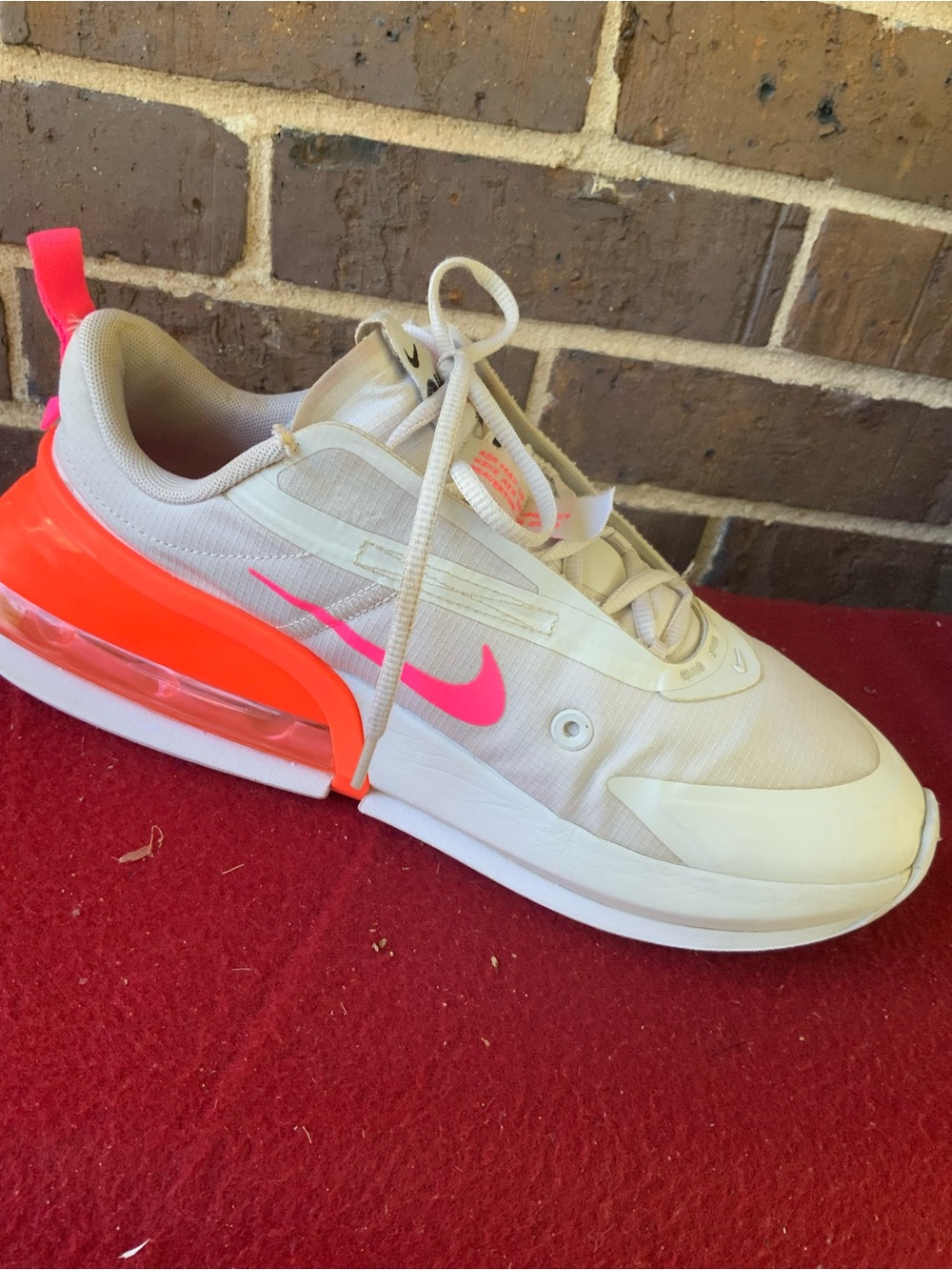 Nike Women’s White Trainer with Neon Pink and Bright Orange Accents
